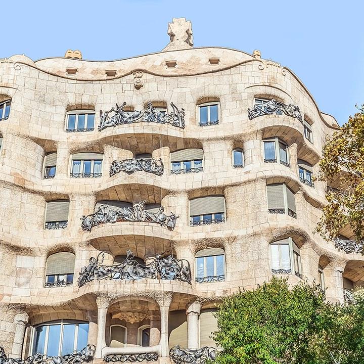 The undulating stone facade and iron balconies of Casa Milà, La Pedrera, in Barcelona