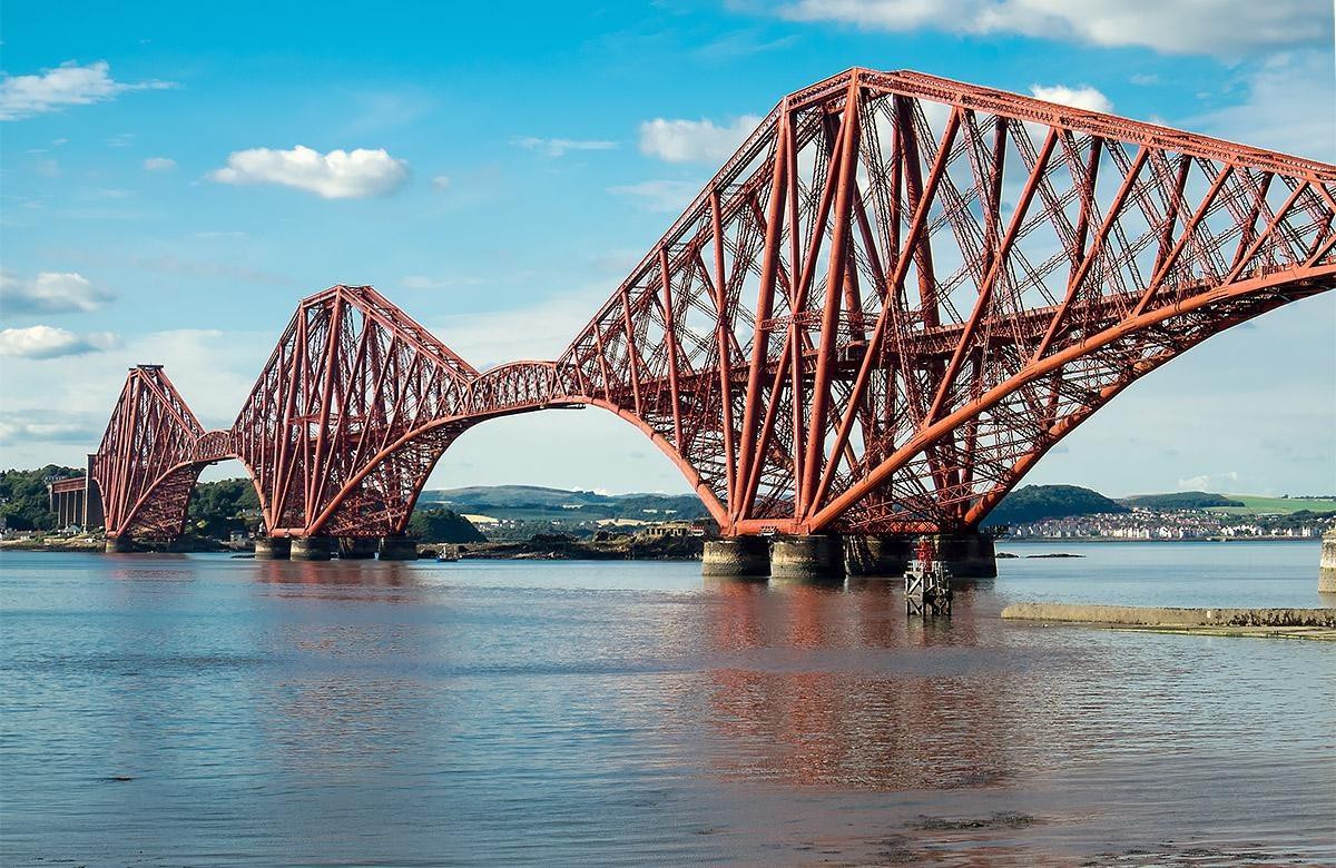 The Forth Bridge, three red cantilevered steel spans over the Firth of Forth
