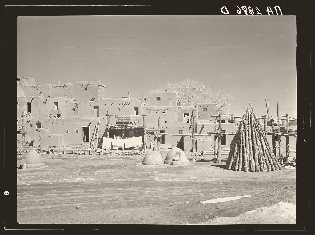Taos Pueblo, New Mexico, in 1939: thick adobe walls and timber ladders