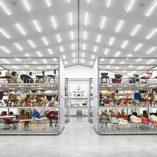 Rows of chairs on open racks inside the Vitra Schaudepot